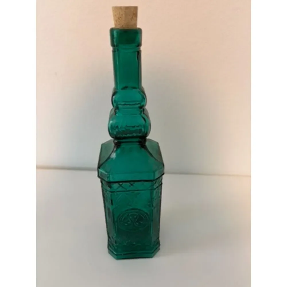 vtg emerald green glass decanter bottle with embossed sides and cork stopper